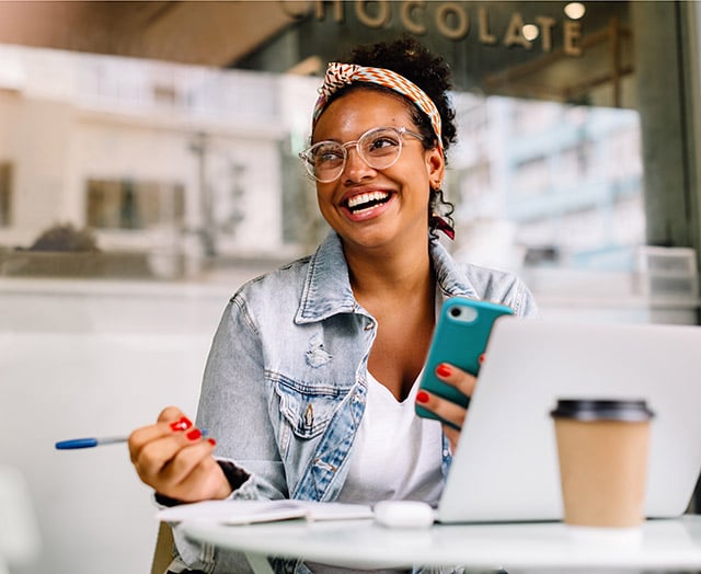 Female happy with reaching her savings goals with Leaders
