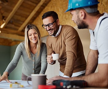 Happy couple with their bridge-to-construction home loan