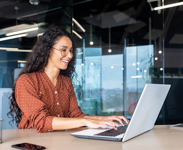 Female happy to join the Leaders Annual Meeting from laptop